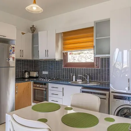 Апартаменты Special 2 Bedroom Terrace With A Unique Sunset View Guemuesluek Бодрум