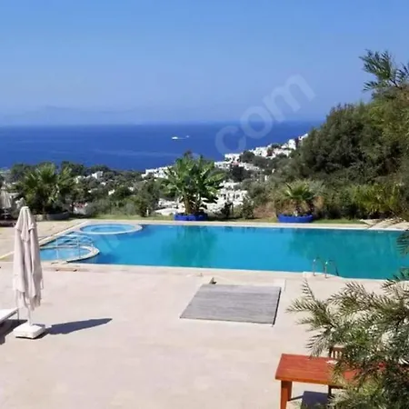 Апартаменты Special 2 Bedroom Terrace With A Unique Sunset View Guemuesluek